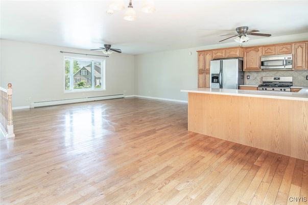 Empty room, Interior, Kitchen, Stainless Steel Appliances, Wood Texture Flooring