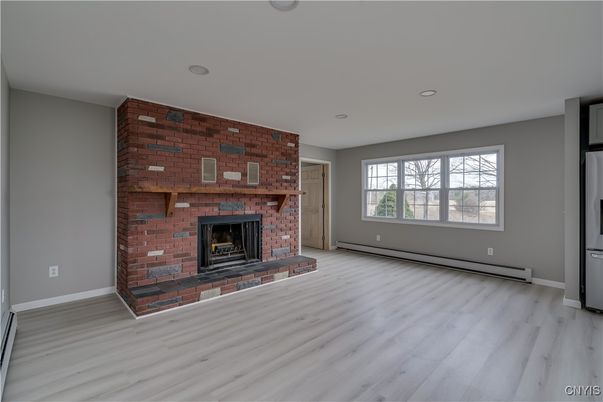 Empty room, Fireplace, Interior, Recessed Lighting, Stone Walls, Wood Texture Flooring