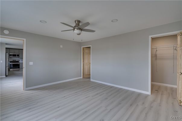 Empty room, Interior, Kitchen, Stainless Steel Appliances, Wood Texture Flooring