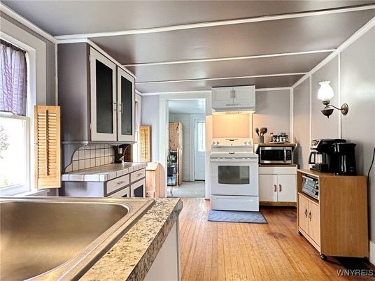 Interior, Kitchen, Tile Countertops, Wood Texture Flooring