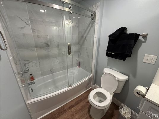 Bathroom, Glass Shower, Interior, Marble Walls, Wood Texture Flooring