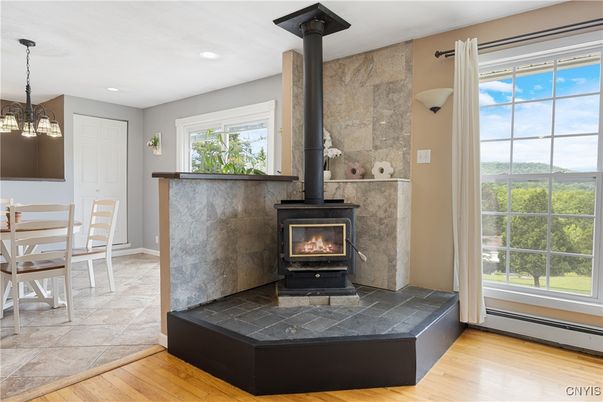Dining room, Fireplace, Interior, Pendant Lights, Recessed Lighting, Wood Texture Flooring