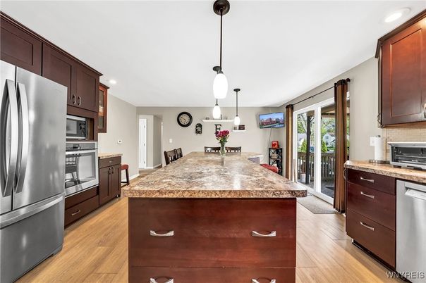 Dining room, Interior, Kitchen, Pendant Lights, Recessed Lighting, Stainless Steel Appliances, Wood Texture Flooring