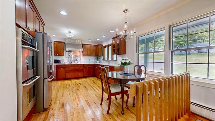 Chandelier, Dining room, Interior, Kitchen, Pendant Lights, Recessed Lighting, Stainless Steel Appliances, Wood Texture Flooring