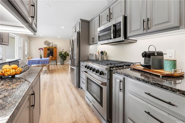 Dining room, Interior, Kitchen, Recessed Lighting, Stainless Steel Appliances, Wood Texture Flooring