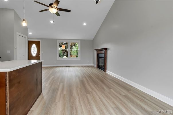 Empty room, Fireplace, Interior, Pendant Lights, Recessed Lighting, Wood Texture Flooring