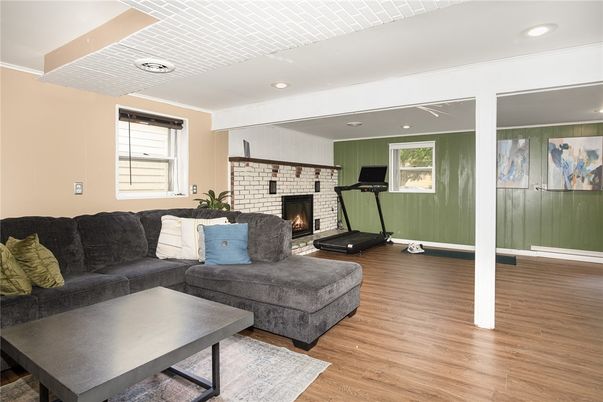 Fireplace, Fitness Equipment, Interior, Living room, Recessed Lighting, Wood Texture Flooring