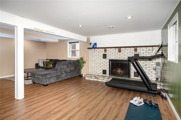 Fireplace, Fitness Equipment, Interior, Recessed Lighting, Stone Walls, Wood Texture Flooring