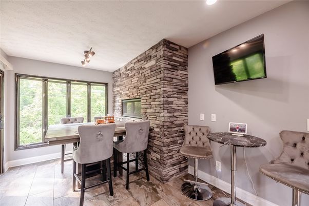 Dining room, Fireplace, Interior, Recessed Lighting, Stone Walls