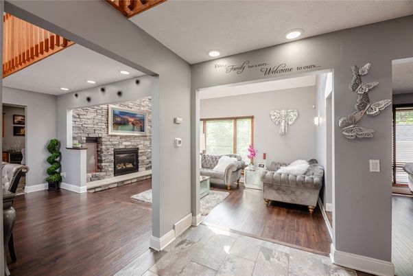 Fireplace, Interior, Living room, Recessed Lighting, Stone Walls, Wood Texture Flooring