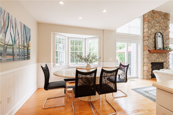 Dining room, Fireplace, Interior, Recessed Lighting, Stone Walls, Wood Texture Flooring