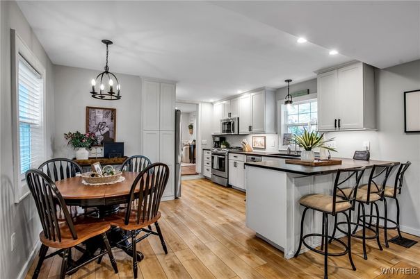 Dining room, Interior, Kitchen, Pendant Lights, Recessed Lighting, Stainless Steel Appliances, Wood Texture Flooring