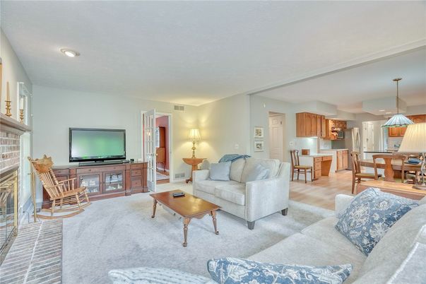 Dining room, Fireplace, Interior, Kitchen, Living room, Recessed Lighting, Stainless Steel Appliances, Wood Texture Flooring