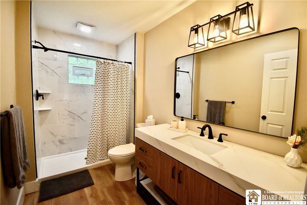 Bathroom, Glass Shower, Interior, Marble Walls, Recessed Lighting, Wood Texture Flooring