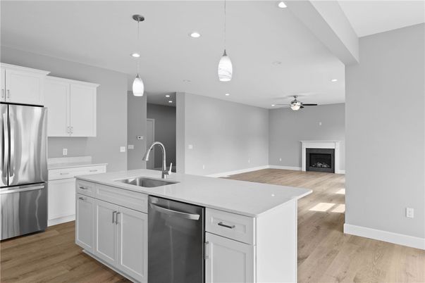 Fireplace, Interior, Kitchen, Pendant Lights, Recessed Lighting, Stainless Steel Appliances, Wood Texture Flooring