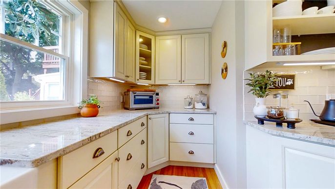 Interior, Kitchen, Recessed Lighting, Tile Countertops, Wood Texture Flooring