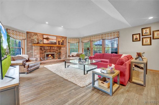 Fireplace, Interior, Living room, Recessed Lighting, Stone Walls, Wood Texture Flooring