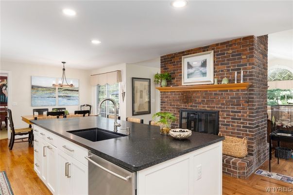 Dining room, Fireplace, Interior, Kitchen, Pendant Lights, Recessed Lighting, Stainless Steel Appliances, Stone Walls, Wood Texture Flooring