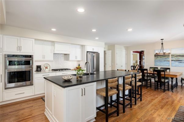 Dining room, Interior, Kitchen, Pendant Lights, Recessed Lighting, Stainless Steel Appliances, Water, Wood Texture Flooring