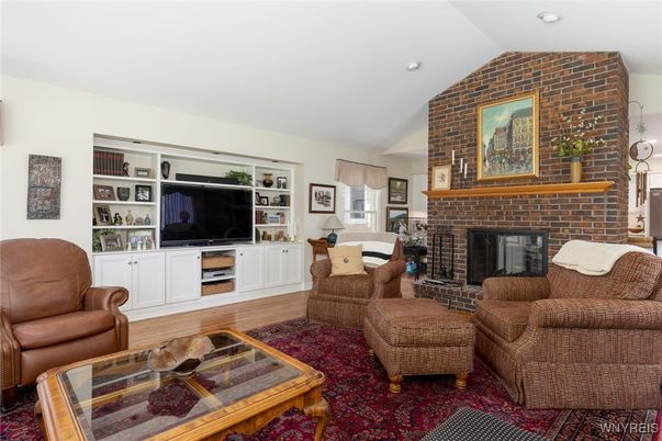 Fireplace, Interior, Living room, Recessed Lighting, Stone Walls, Wood Texture Flooring