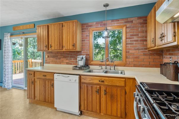 Interior, Kitchen, Pendant Lights, Stainless Steel Appliances, Stone Walls