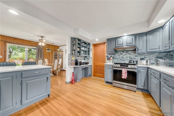 Dining room, Interior, Kitchen, Recessed Lighting, Stainless Steel Appliances, Wood Texture Flooring, Wooden Walls