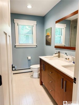 Bathroom, Dual Sink Vanities, Interior, Recessed Lighting, Wood Texture Flooring