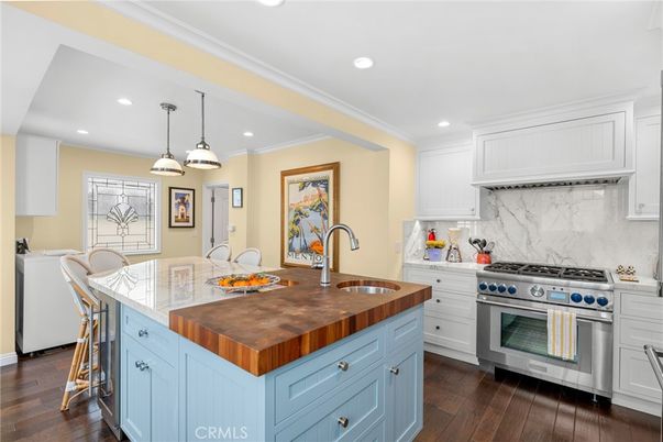 Interior, Kitchen, Marble Walls, Pendant Lights, Recessed Lighting, Stainless Steel Appliances, Wood Texture Flooring