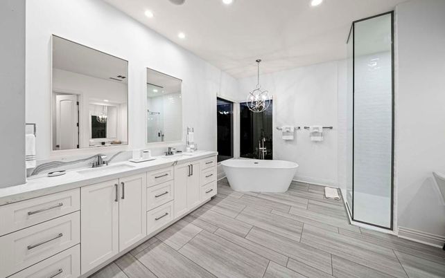 Bathroom, Chandelier, Dual Sink Vanities, Free Standing Baths, Glass Shower, Interior, Pendant Lights, Recessed Lighting, Wood Texture Flooring