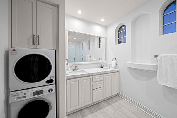 Bathroom, Dual Sink Vanities, Interior, Recessed Lighting, Washer, Wood Texture Flooring