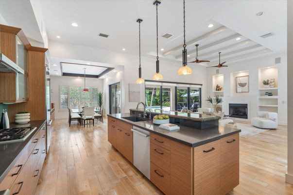 Dining room, Fireplace, Interior, Kitchen, Living room, Pendant Lights, Recessed Lighting, Stainless Steel Appliances, Wood Texture Flooring