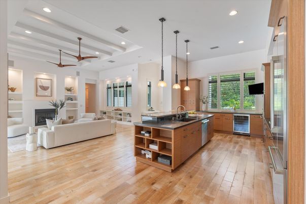 Fireplace, Interior, Kitchen, Living room, Pendant Lights, Recessed Lighting, Stainless Steel Appliances, Wood Texture Flooring