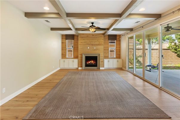 Empty room, Fireplace, Interior, Recessed Lighting, Stone Walls, Wood Texture Flooring