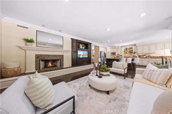 Dining room, Fireplace, Interior, Kitchen, Living room, Recessed Lighting, Stainless Steel Appliances, Wood Texture Flooring