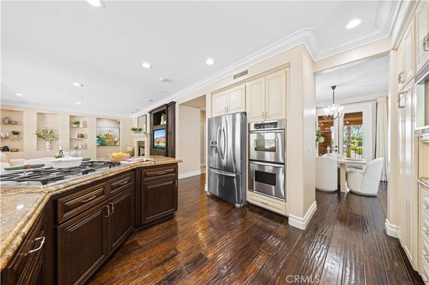Chandelier, Dining room, Interior, Kitchen, Recessed Lighting, Stainless Steel Appliances, Wood Texture Flooring