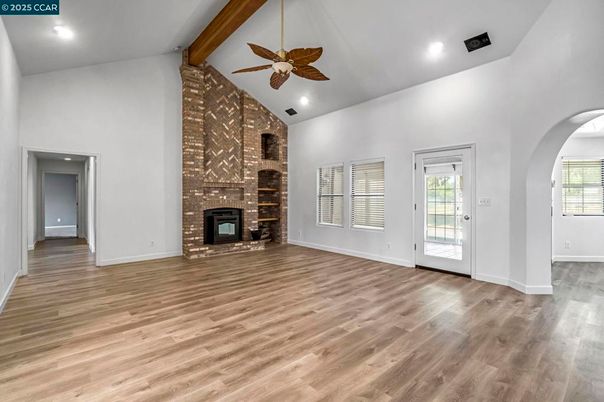 Empty room, Fireplace, Interior, Recessed Lighting, Stone Walls, Wooden Beams, Wood Texture Flooring