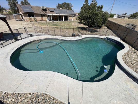 Exterior, Pool, Solar Panels