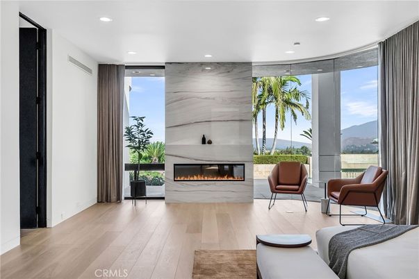 Fireplace, Interior, Living room, Marble Walls, Recessed Lighting, Wood Texture Flooring
