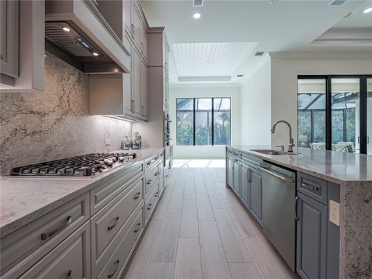 Interior, Kitchen, Marble Walls, Recessed Lighting, Stainless Steel Appliances, Wood Texture Flooring