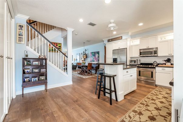 Chandelier, Dining room, Interior, Kitchen, Pendant Lights, Recessed Lighting, Stainless Steel Appliances, Wood Texture Flooring
