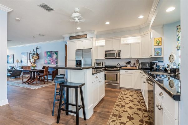 Dining room, Interior, Kitchen, Living room, Pendant Lights, Recessed Lighting, Stainless Steel Appliances, Wood Texture Flooring