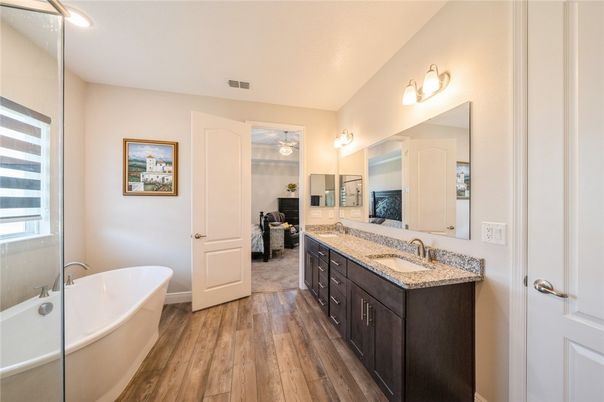Bathroom, Dual Sink Vanities, Free Standing Baths, Interior, Recessed Lighting, Wood Texture Flooring