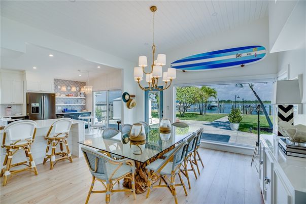 Chandelier, Dining room, Interior, Kitchen, Pendant Lights, Recessed Lighting, Stainless Steel Appliances, Wood Texture Flooring