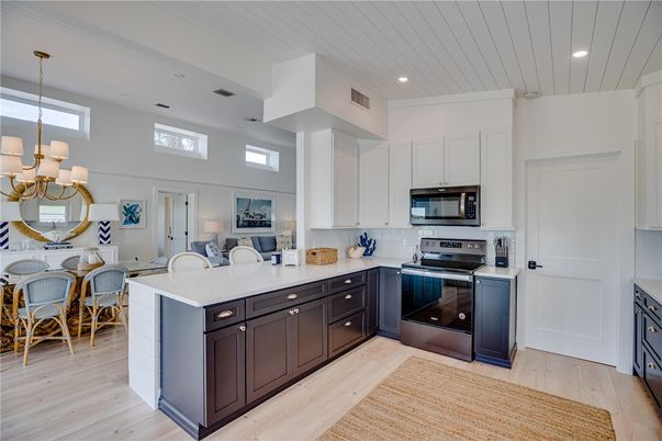 Chandelier, Dining room, Interior, Kitchen, Pendant Lights, Recessed Lighting, Stainless Steel Appliances, Wood Texture Flooring