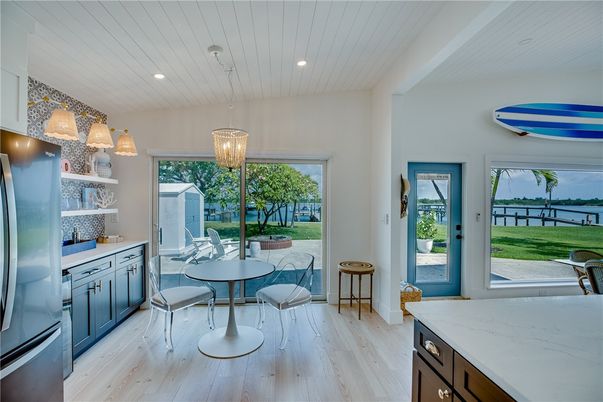 Chandelier, Dining room, Interior, Kitchen, Pendant Lights, Recessed Lighting, Water, Wood Texture Flooring