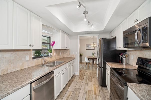 Dining room, Interior, Kitchen, Pendant Lights, Stainless Steel Appliances, Wood Texture Flooring