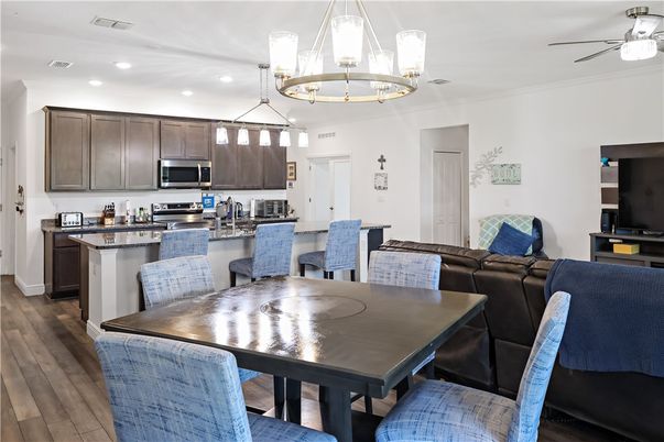 Dining room, Interior, Kitchen, Pendant Lights, Recessed Lighting, Stainless Steel Appliances, Wood Texture Flooring