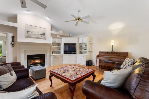 Fireplace, Interior, Living room, Piano, Recessed Lighting, Wood Texture Flooring