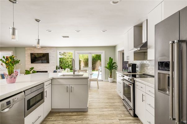Interior, Kitchen, Pendant Lights, Recessed Lighting, Stainless Steel Appliances, Stone Walls, Wood Texture Flooring