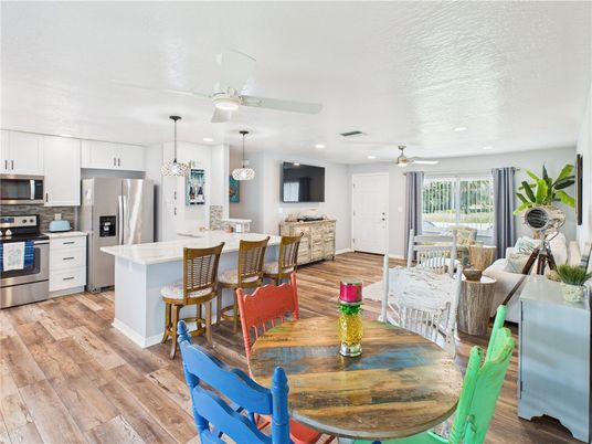 Dining room, Interior, Kitchen, Pendant Lights, Recessed Lighting, Stainless Steel Appliances, Wood Texture Flooring